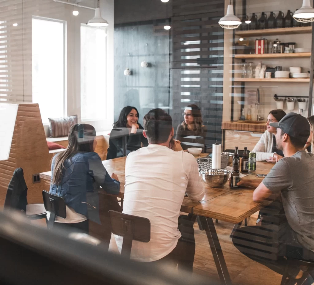 Team meeting around a wooden table in a modern office